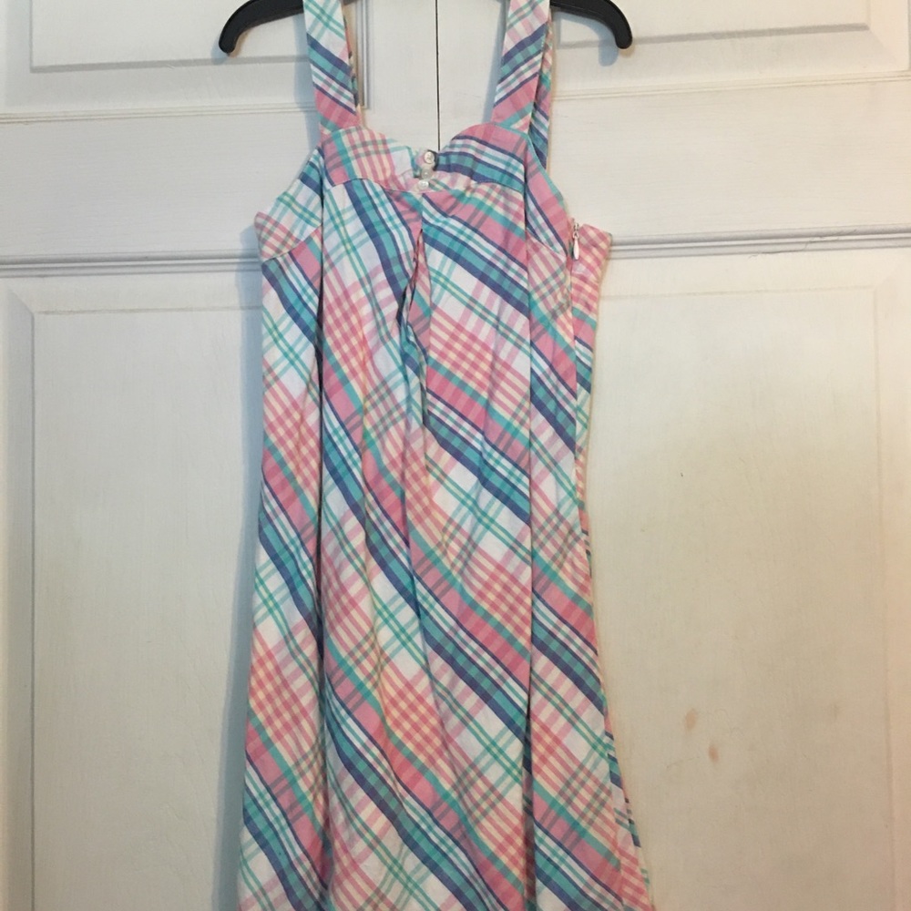 Plaid dress with pearl colored button